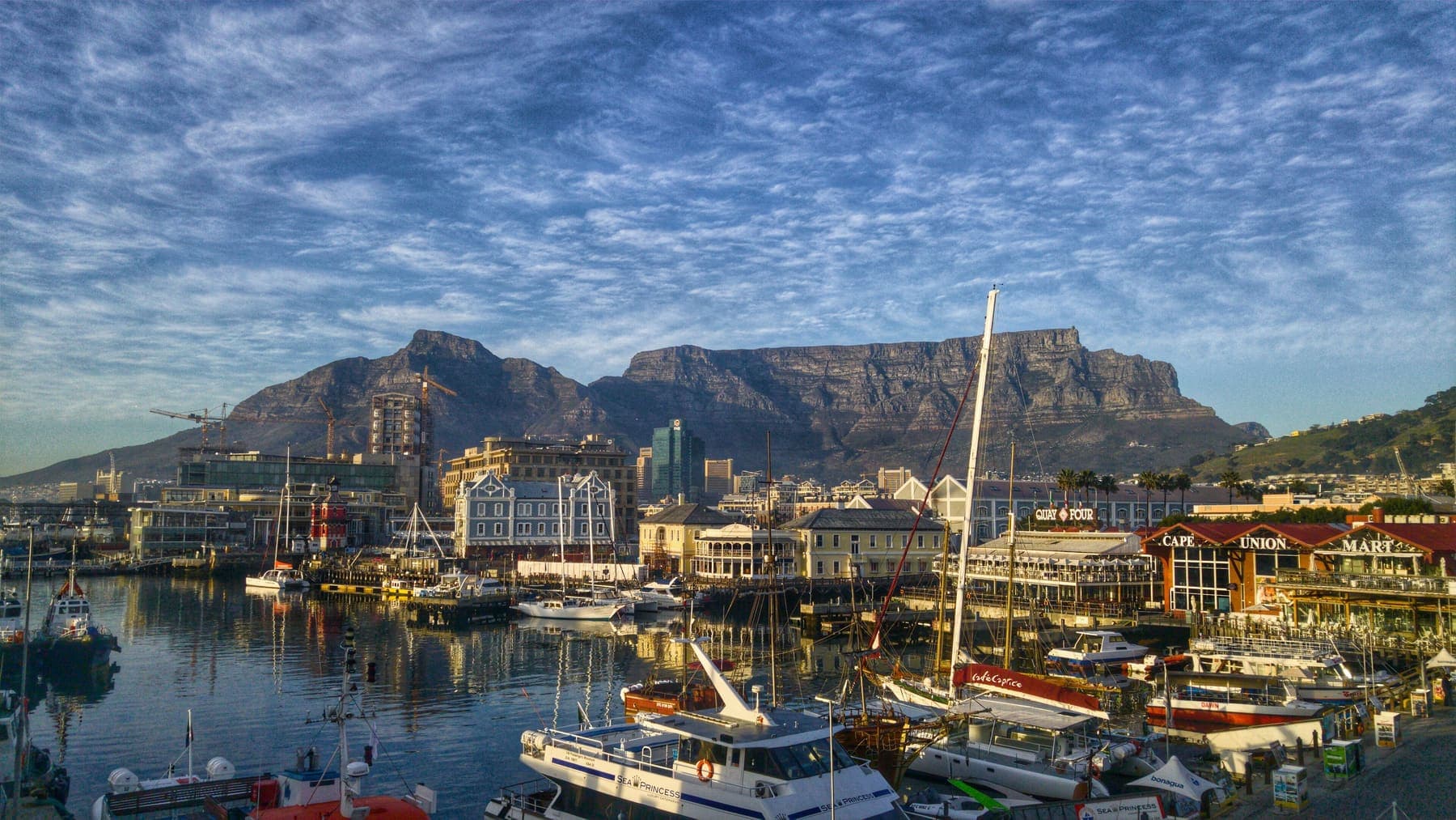 Cape Town harbour with boats and Table Mountain behind