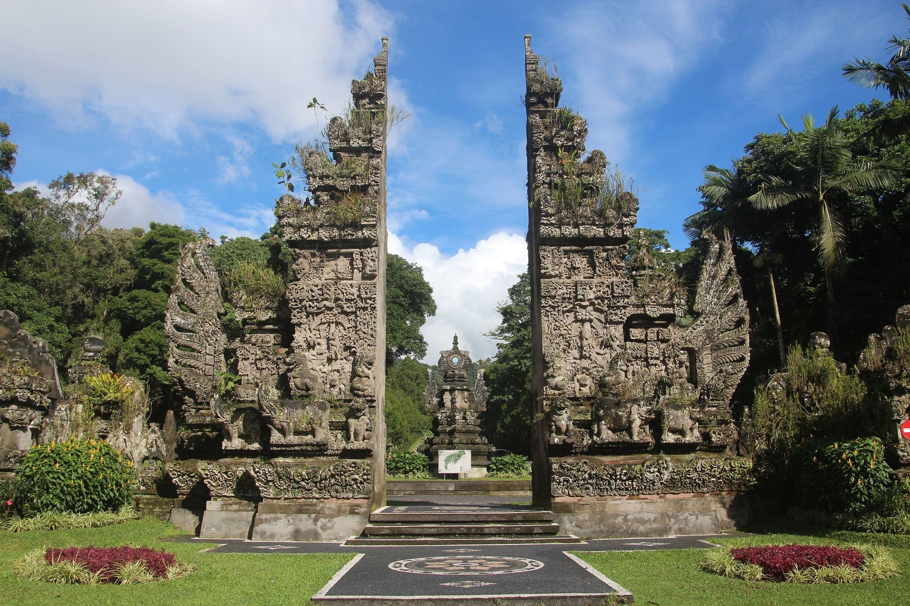 Split stone temple gate in a garden in Bali